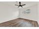 Bright bedroom with wood-look flooring, white walls, natural light and a ceiling fan at 921 W Lake Brantley Rd, Altamonte Springs, FL 32714