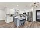 Modern kitchen with an island, white cabinets, granite countertops, and stainless steel appliances at 921 W Lake Brantley Rd, Altamonte Springs, FL 32714