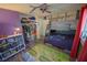 Colorful bedroom with bunk beds, a ceiling fan, a colorful rug and ample storage at 1002 Royalton Rd, Orlando, FL 32825