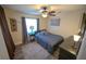 Neutral bedroom with wood-look floors, neutral paint, and a ceiling fan at 1002 Royalton Rd, Orlando, FL 32825