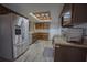 This kitchen features wood cabinets, granite counters, stainless appliances and a skylight at 1002 Royalton Rd, Orlando, FL 32825