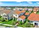 Aerial view of a two-story home with lush landscaping and a tile roof at 10249 Beechwood Ln, Orlando, FL 32832