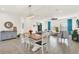 Bright dining area with a stylish table and chairs next to a modern sideboard at 10249 Beechwood Ln, Orlando, FL 32832