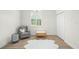 Bright, neutral bedroom with a reading chair, plantation shutters, and hardwood floors at 10361 Mallard Landings Way, Orlando, FL 32832