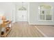 Bright entryway features wood floors, a decorative door, and natural light at 10361 Mallard Landings Way, Orlando, FL 32832