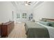 Serene main bedroom features wood floors, tray ceiling, and lots of natural light at 10361 Mallard Landings Way, Orlando, FL 32832