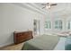 Calm main bedroom with wood floors, windows, and a walk-out at 10361 Mallard Landings Way, Orlando, FL 32832