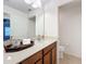 Bright bathroom featuring a sink, granite countertop, and toilet at 10840 Cabbage Tree Loop, Orlando, FL 32825