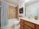 Bathroom with a shower/tub combo, single sink and toilet at 10840 Cabbage Tree Loop, Orlando, FL 32825