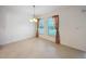 Bright breakfast nook featuring tile flooring, colorful curtains, and natural light from two windows at 10840 Cabbage Tree Loop, Orlando, FL 32825