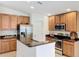 Kitchen featuring stainless steel appliances and granite countertops at 10840 Cabbage Tree Loop, Orlando, FL 32825