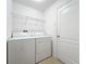 Laundry room featuring a washer, dryer and shelving unit at 10840 Cabbage Tree Loop, Orlando, FL 32825