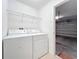 Bright laundry room features a modern washer and dryer plus convenient wire shelving for added storage at 10840 Cabbage Tree Loop, Orlando, FL 32825