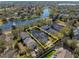 Aerial view of a home bordering a pond within a community known for its golf course and landscaping at 11237 Camden Park Dr, Windermere, FL 34786