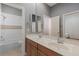 Bathroom featuring a double vanity, large mirror and combination tub and shower at 11237 Camden Park Dr, Windermere, FL 34786