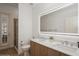 An elegant bathroom featuring double sinks, a glass enclosed shower, and recessed lighting at 11237 Camden Park Dr, Windermere, FL 34786