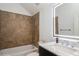 Bathroom boasts tiled shower, marble countertop, and illuminated mirror at 11237 Camden Park Dr, Windermere, FL 34786