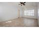 Primary bedroom with tray ceilings, tile floor and shuttered window for ambient light at 11237 Camden Park Dr, Windermere, FL 34786