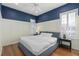 Bedroom featuring wainscoting, hardwood floors, a ceiling fan and natural light at 11237 Camden Park Dr, Windermere, FL 34786