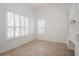 Bedroom featuring large windows with shutters, built-in shelving and tiled floors at 11237 Camden Park Dr, Windermere, FL 34786