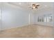 Light-filled bedroom with tile floors, plantation shutters, and ample space at 11237 Camden Park Dr, Windermere, FL 34786