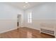 Bright bedroom featuring wood floors, a crib and natural light at 11237 Camden Park Dr, Windermere, FL 34786