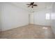 Bright, airy bedroom with neutral tile flooring, a ceiling fan and recessed lighting at 11237 Camden Park Dr, Windermere, FL 34786