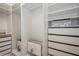 Walk-in closet with built-in shelving and drawer systems at 11237 Camden Park Dr, Windermere, FL 34786