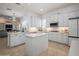 Modern kitchen featuring stainless steel appliances, tile flooring and a center island at 11237 Camden Park Dr, Windermere, FL 34786