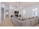 Bright living room with a fireplace, built-in shelves and stylish decor at 11237 Camden Park Dr, Windermere, FL 34786