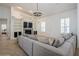 Bright living room with a fireplace, built-in shelves, and a stylish chandelier at 11237 Camden Park Dr, Windermere, FL 34786