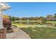 Picturesque pond view with a fountain, surrounded by trees and a walking path at 11237 Camden Park Dr, Windermere, FL 34786