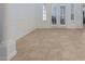 Neutral room with tile flooring, baseboard trim and French doors with shutter coverings at 11237 Camden Park Dr, Windermere, FL 34786