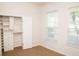 Bedroom with natural light, closet with shelving, and drawers creating a calming atmosphere at 11474 Claymont Cir, Windermere, FL 34786