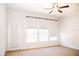 Bedroom featuring carpet, ceiling fan, and natural light from multiple windows at 11474 Claymont Cir, Windermere, FL 34786