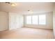 Bright bonus room featuring neutral carpet, multiple windows, and ample closet space at 11474 Claymont Cir, Windermere, FL 34786
