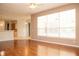 Living room showcasing wood floors, a ceiling fan, and lots of natural light at 11474 Claymont Cir, Windermere, FL 34786
