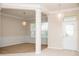 Open-concept living room with decorative lighting and neutral tones throughout at 11474 Claymont Cir, Windermere, FL 34786
