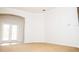 Spacious room with carpet, arched doorway, and French doors to lanai at 11474 Claymont Cir, Windermere, FL 34786