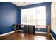 Office space with built-in desk, hardwood floors and natural light creating a productive workspace at 11474 Claymont Cir, Windermere, FL 34786