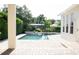 Private swimming pool and spa with lush tropical landscaping creating a relaxing backyard retreat at 11474 Claymont Cir, Windermere, FL 34786