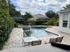 Backyard pool and patio area with a hot tub at 11474 Claymont Cir, Windermere, FL 34786