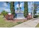 Berkley Reserve community entrance sign framed by greenery and manicured landscaping under a sunny sky at 1306 Windward Oaks Loop, Auburndale, FL 33823