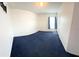 Well-lit bedroom featuring carpet and a window with covering creating a peaceful atmosphere at 1318 Daniels Cove Dr, Winter Garden, FL 34787