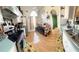 Cozy kitchen with wood floors and sunflower-themed decor; dining table situated near the entrance at 1318 Daniels Cove Dr, Winter Garden, FL 34787