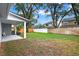 An expansive backyard with mature trees, a white fence and a wooden fence for added privacy at 1341 American Elm Dr, Altamonte Springs, FL 32714