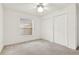 Bedroom featuring neutral carpet, ceiling fan, a window overlooking the exterior, and a closet at 1341 American Elm Dr, Altamonte Springs, FL 32714