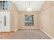 Dining room showcases plush carpeting, neutral walls, and a window overlooking the front yard at 1341 American Elm Dr, Altamonte Springs, FL 32714