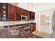 This kitchen features granite countertops and modern stainless-steel appliances at 1341 American Elm Dr, Altamonte Springs, FL 32714