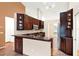 Well-equipped kitchen showcases custom cabinets and tile flooring at 1341 American Elm Dr, Altamonte Springs, FL 32714